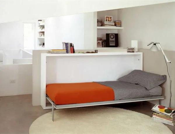 Кровать-тумба может служить разделением комнаты на зоны