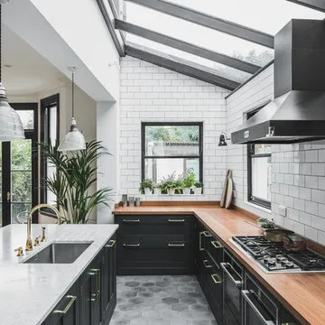 Industrial Dark Green Kitchen with a Vintage Twist