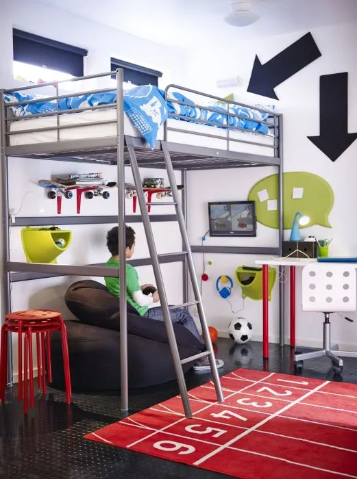 The raised sleeping area of the SVARTA loft bed creates the floor space for a cool hang-out spot underneath.